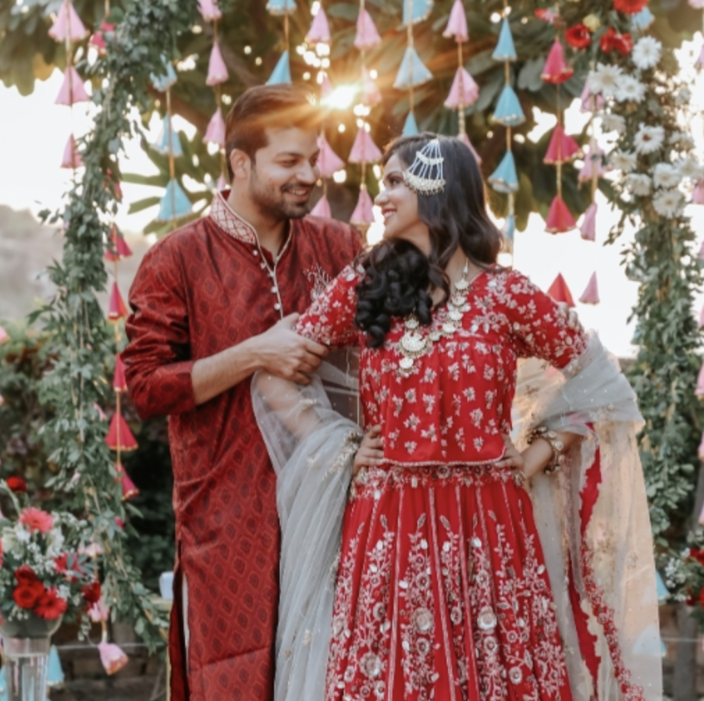 A smiling couple at their wedding