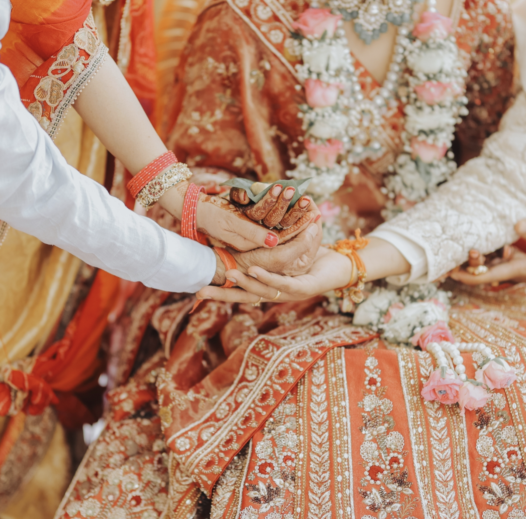 A groom adjusting his tie